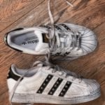 adidas superstar borchiate uomo